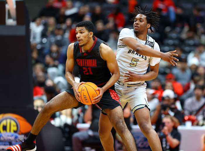 In the same game Aaron McBride (21) made the state's biggest play, here he muscles up for an inside hoop. Photo: Nick Koza.